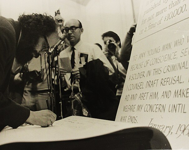 Allen Ginsber, author of "Howl" signs a petition