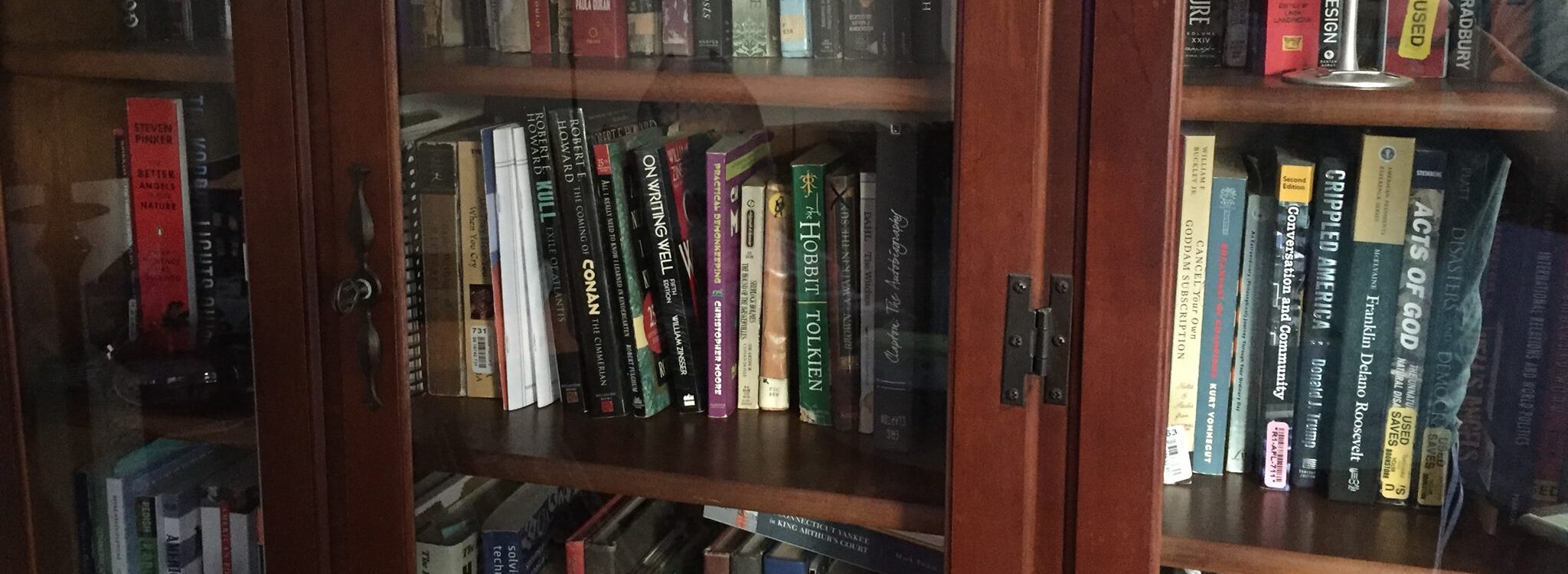 a bookshelf with an eclectic collection