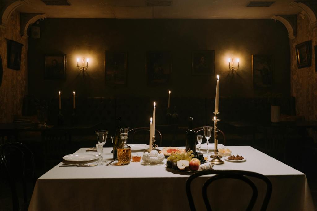 a table setting in a candle lit room